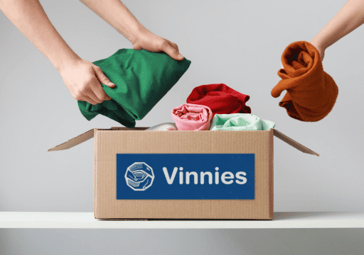 image of clothes being donated into Vinnies donation box, mobile skips collection program